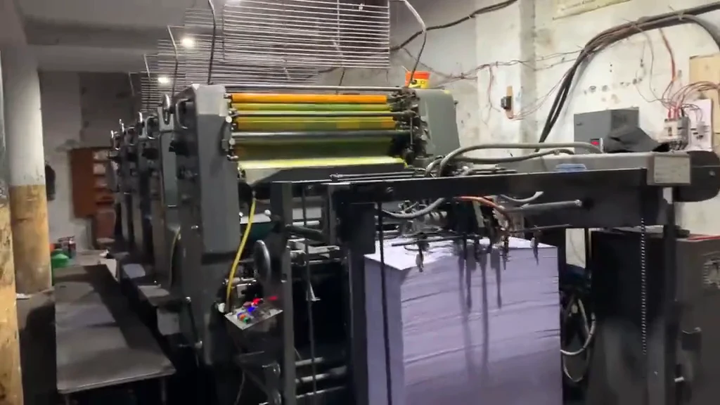 Our offset press printing packaging sheets in colour on the factory floor in Lahore
