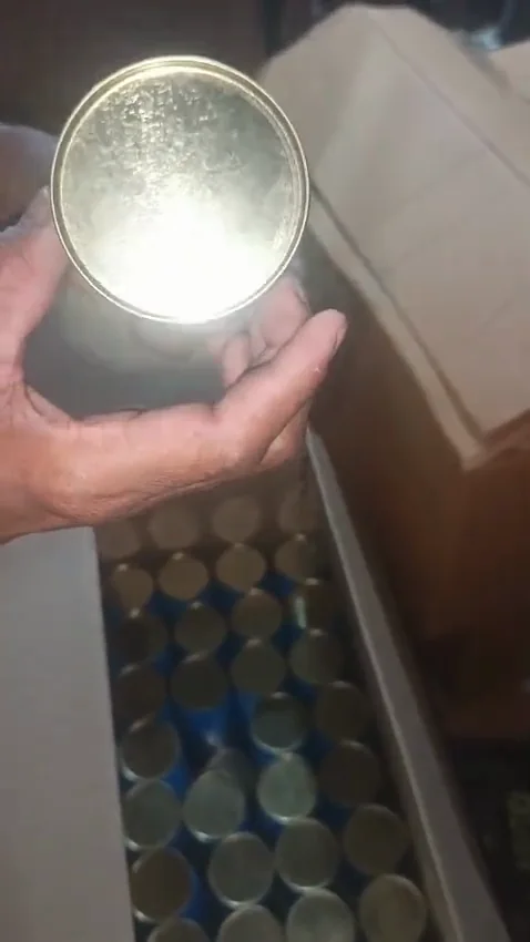 A bulk paper tube run with tinplate lids, packed and loaded