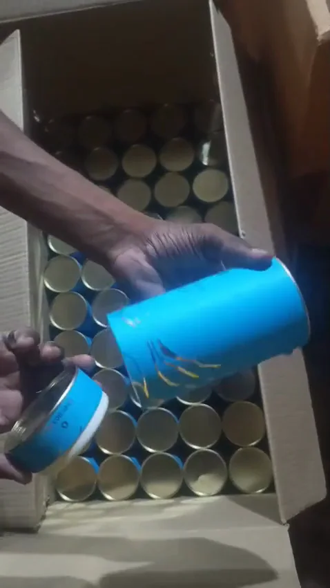 A bulk paper tube run with tinplate lids, packed and loaded